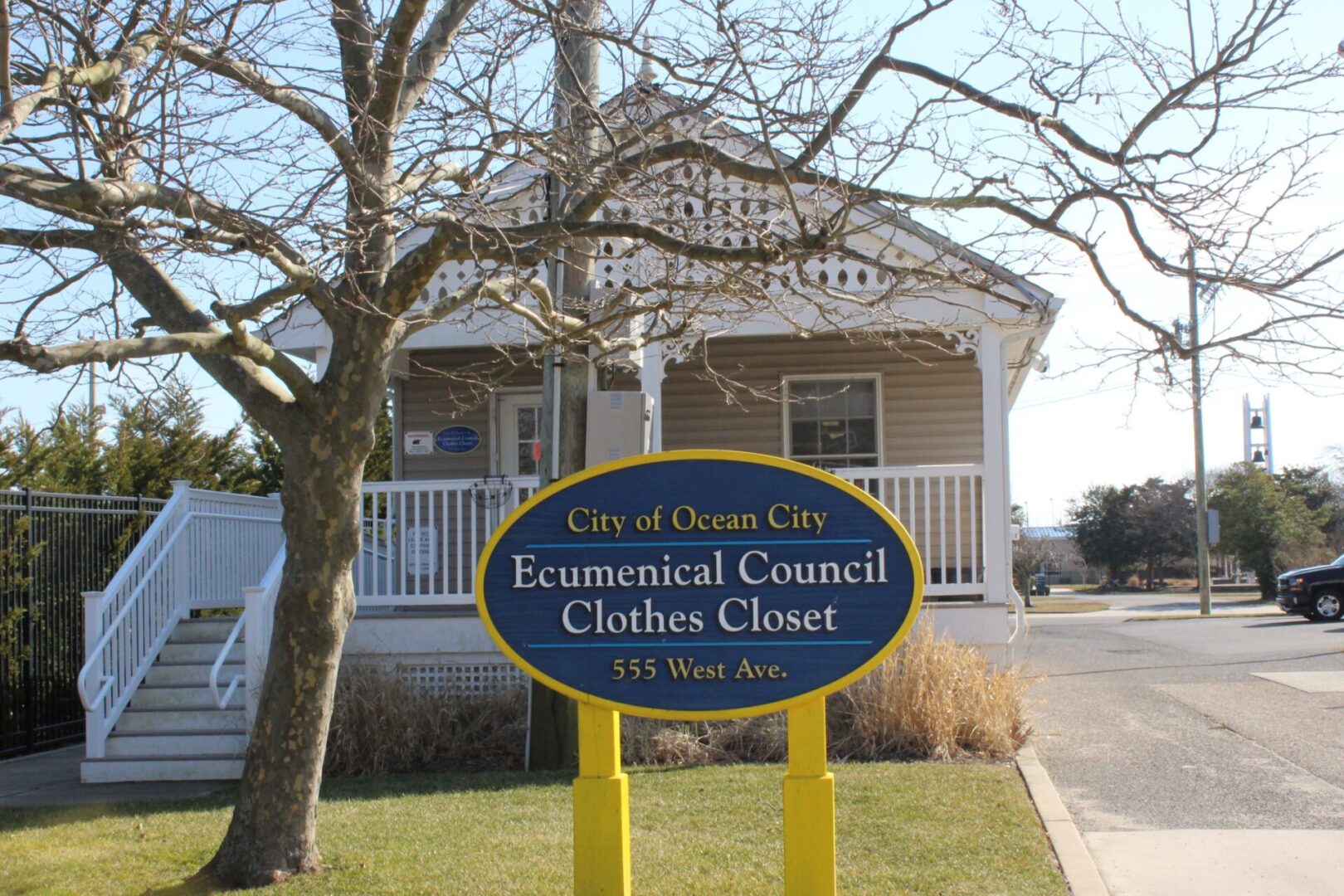 A sign in front of a house that says ecumenical council clothes closet.